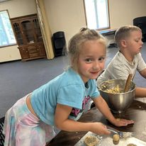 Children learning to cook at Atchison summer camp